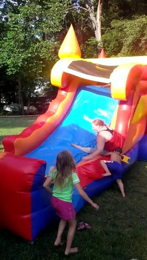 Little Girl Falls Backwards Playing at Bounce House Jukin Media Inc