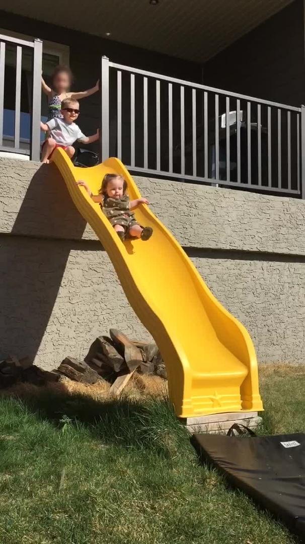 Little Girl Proud of Falling Down Slide Jukin Media Inc