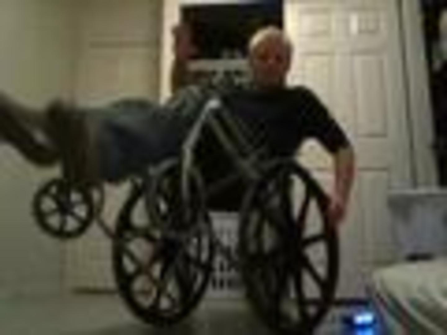 Guy Falls Over Backwards While Trying to Do Wheelie on Wheelchair