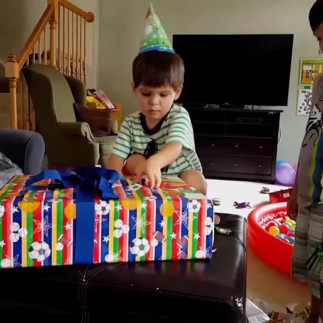 Birthday Boy Falls Off Couch While Opening Presents Jukin Licensing