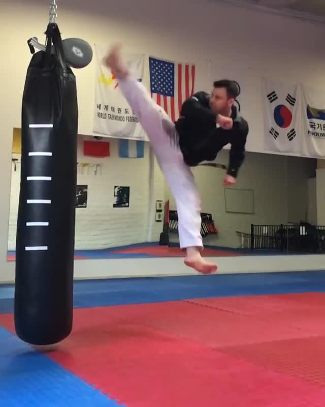 Guy Does Pushups While Hitting Punching Bag Jukin Media Inc Guy Kicks Paddle On Top Of Punching Bag