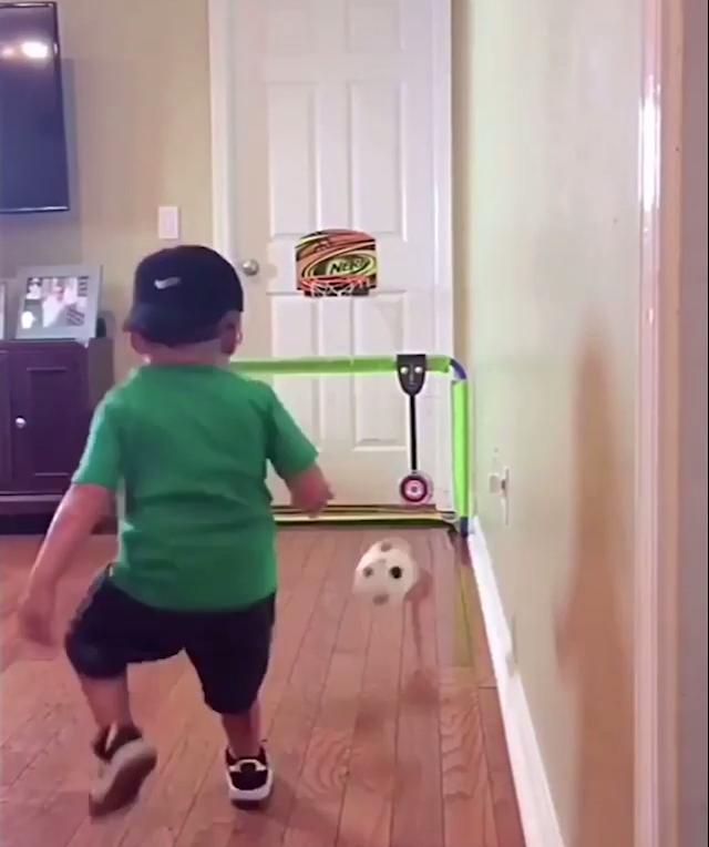 Kid Kicks Ball into Bucket Jukin Media Inc