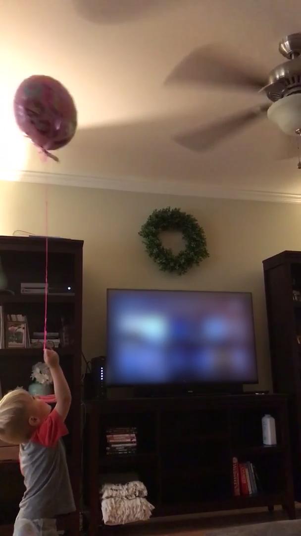 Father Knocks Around Helium Balloons With Ceiling Fan Jukin Media Inc Boy Bounces Balloon Off Ceiling Fan