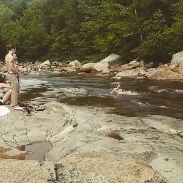 Woman Slips on Rocks Next to Waterfall Jukin Licensing