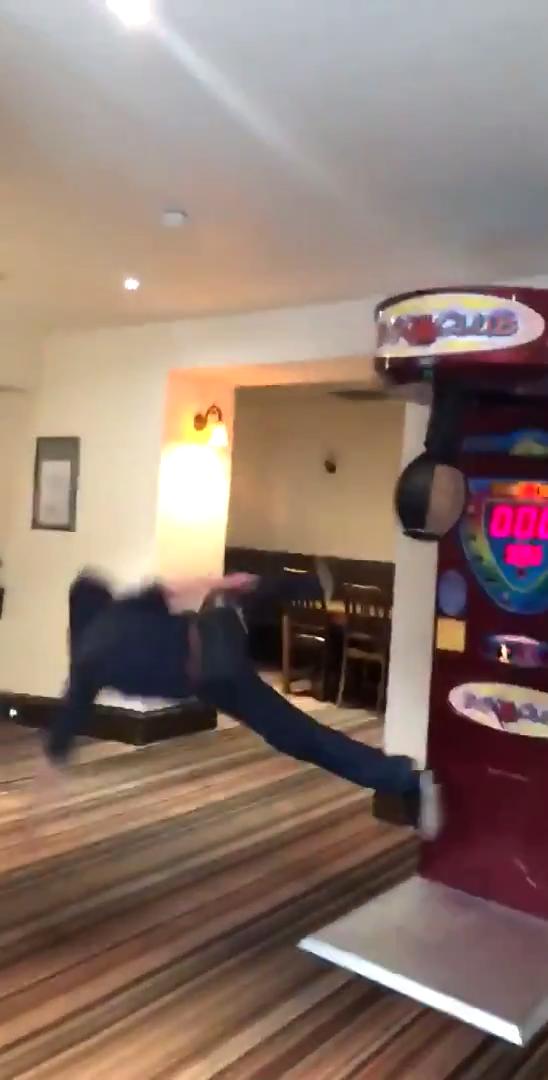 Guy Faceplants After Attempting To Kick Arcade Game Jukin Licensing