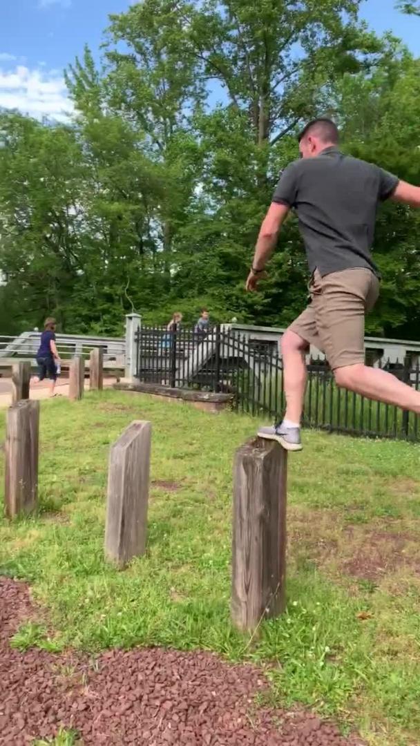 Guy Falls and Hits Crotch Attempting to Walk Across Wooden Posts