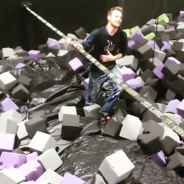 Guy Walking on Slackline in Trampoline Park Falls on Stomach Jukin