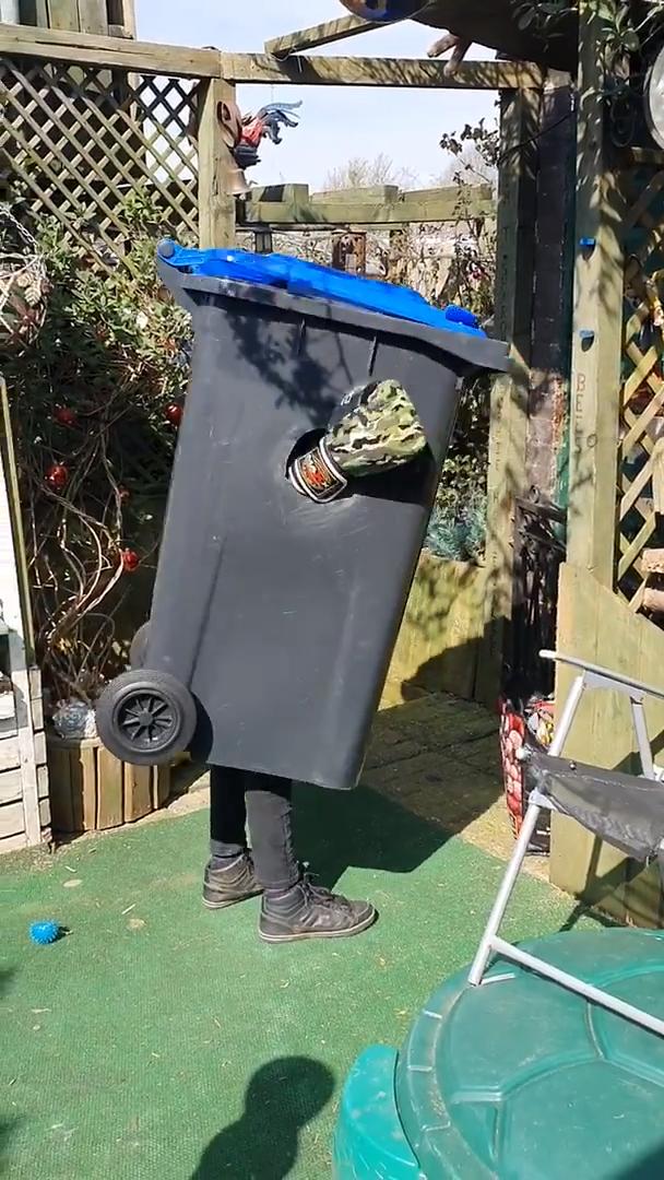 Kid Dressed as Trashcan Punches Imaginary Opponent in Yard Jukin
