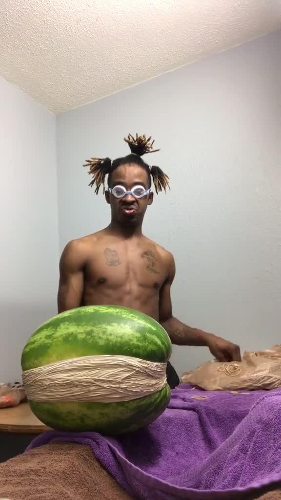 Guy in Self Isolation Puts Rubber Bands on Watermelon to Make it