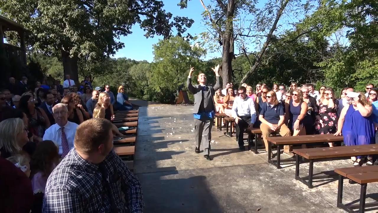 Flower Guy at Wedding Strews Petals From Fanny Packs as He Struts Down