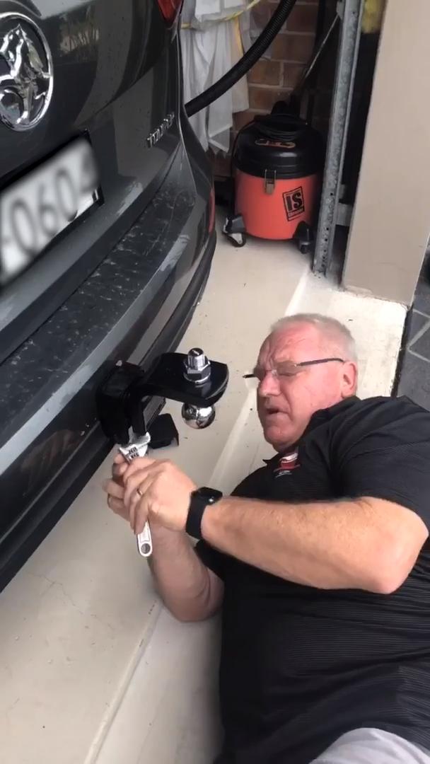 Daughter Waits to Correct Man Until He is Done Putting Trailer Hitch