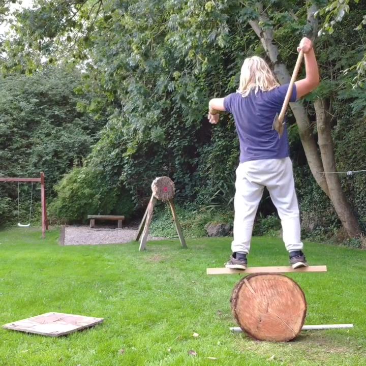 Two Guys Throw Axe Of Different Sizes Amazingly Hitting Bullseye At
