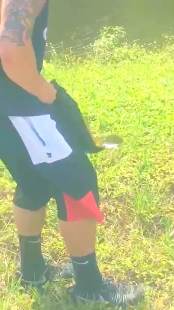 Guy Throws Alligator a Fish Jukin Licensing