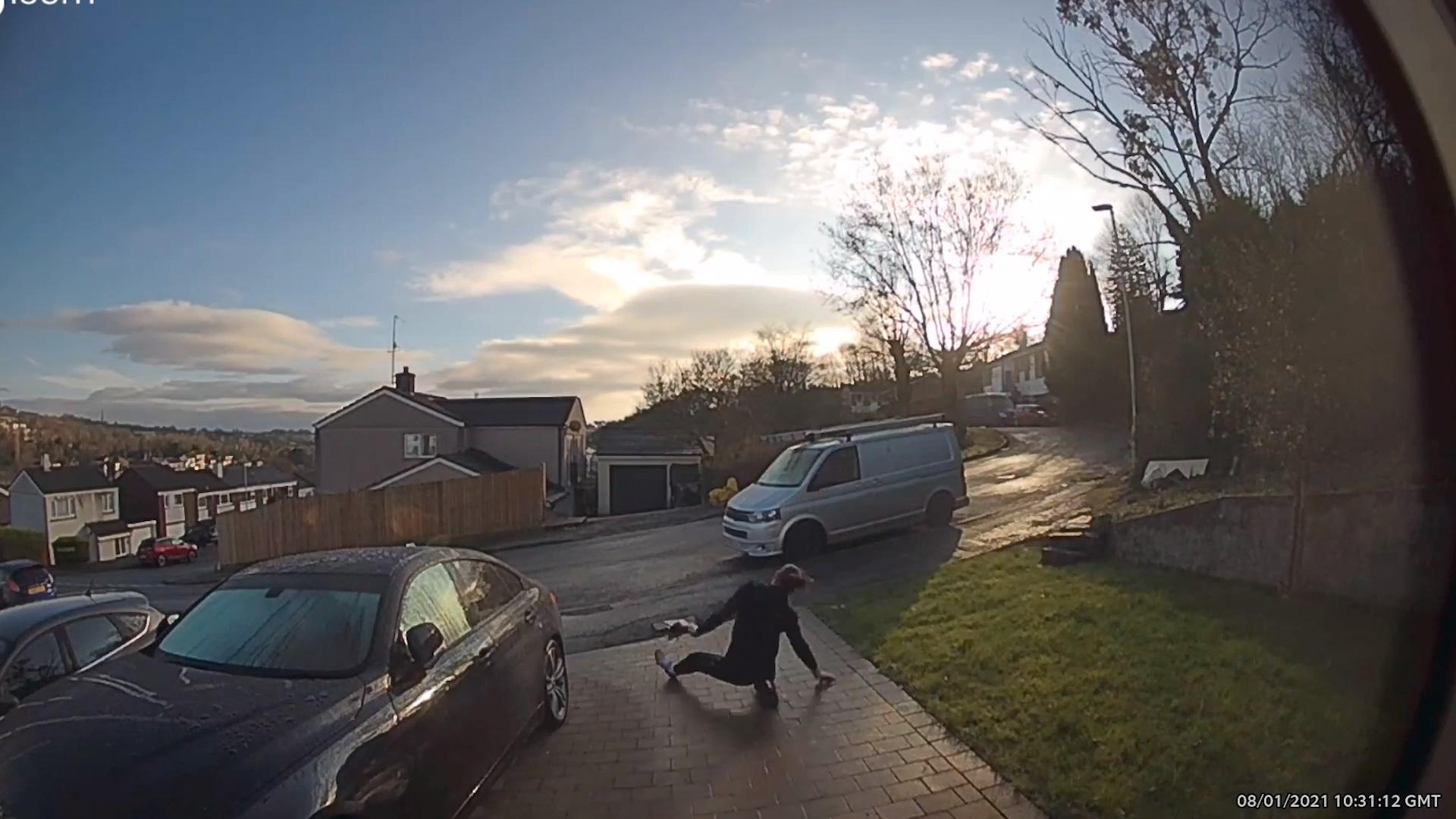 Guy Slips and Almost Snaps his Leg While Walking Down Icy Driveway