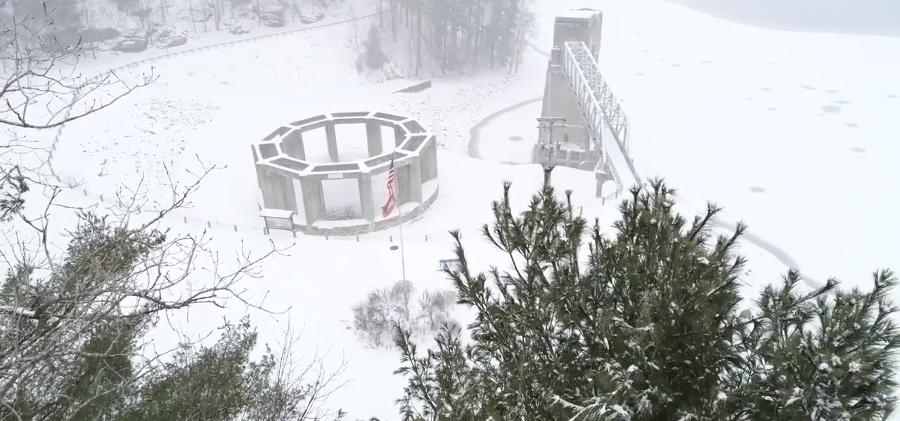 Aerial View of Frozen Pleasant Hill Lake During Snowstorm in Ohio