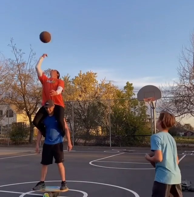 Guy Throws Balls Inside Basket While Standing On Balance Board Jukin Media Inc