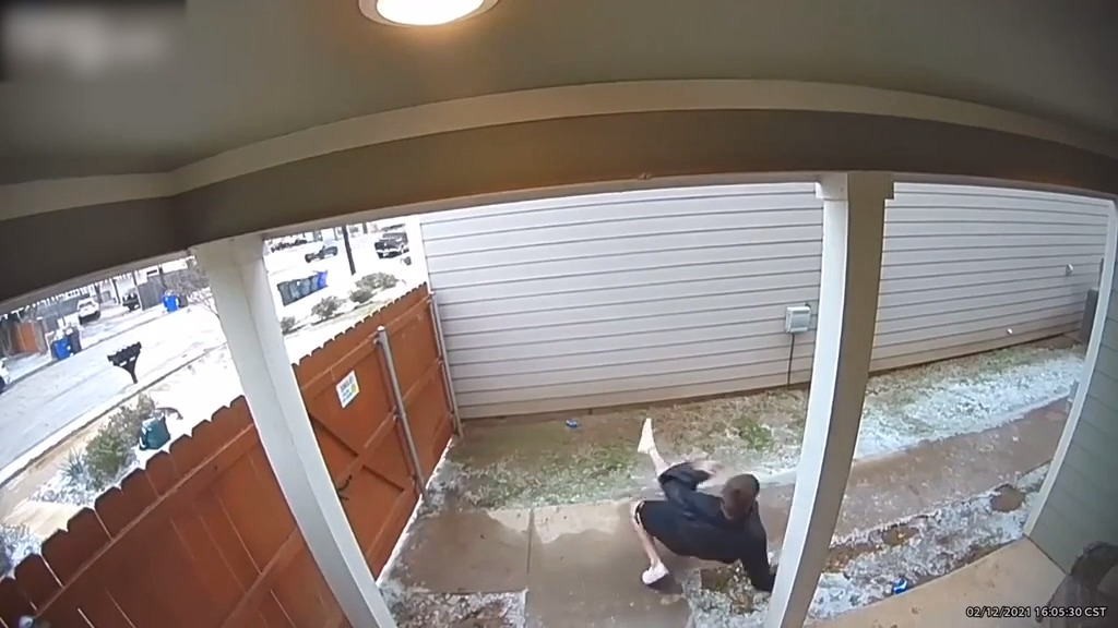 Guy Slips on Ice And Falls Hard in Front of Porch While Leaving House