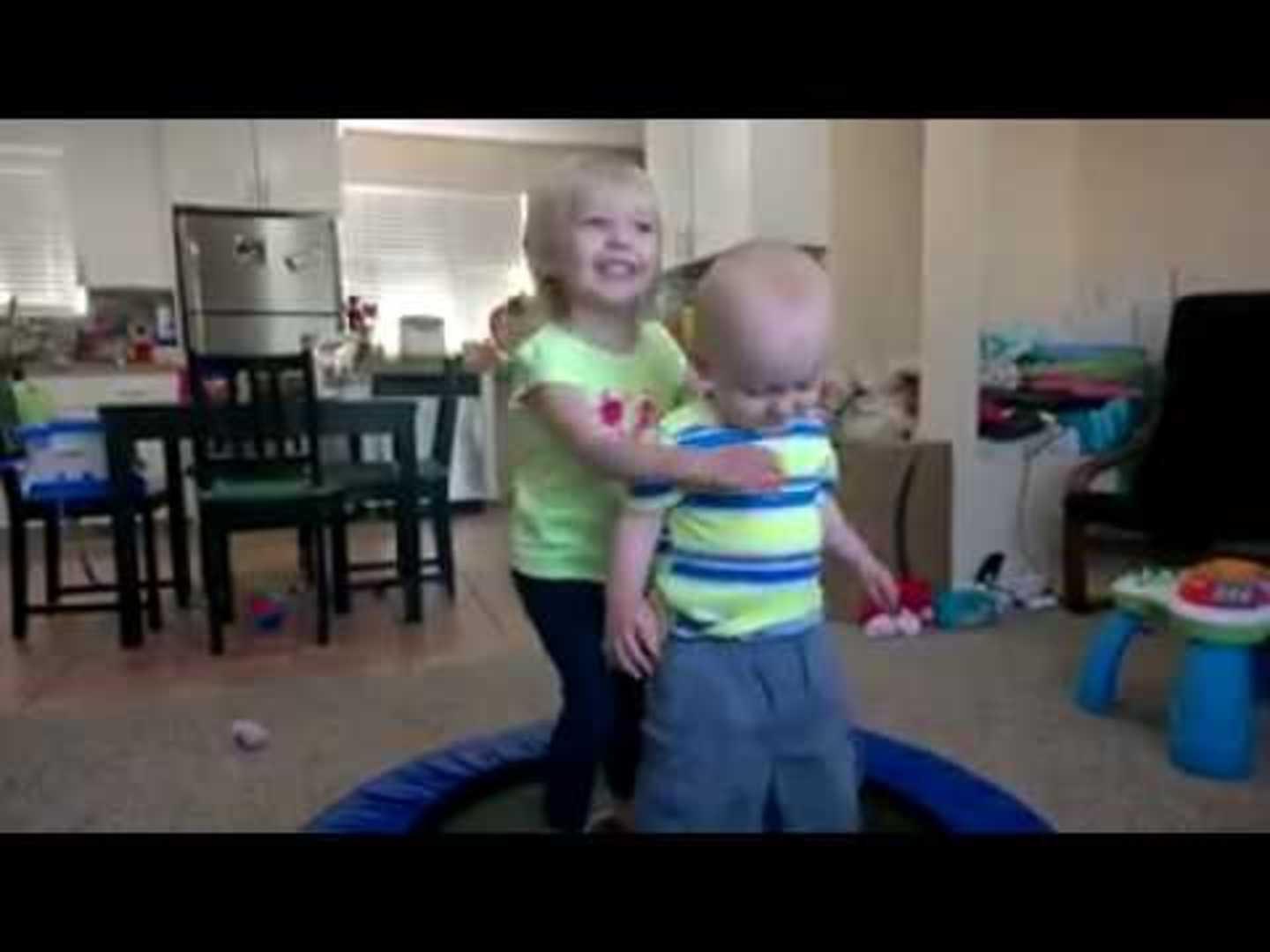 Brother and Sister Fall Off Mini Trampoline Jukin Licensing