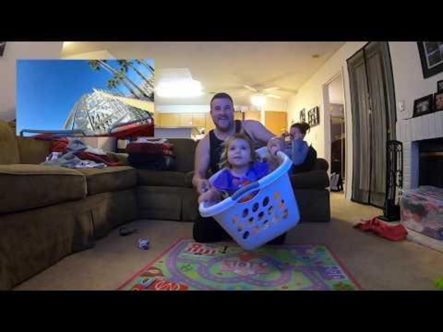 Dad Takes Toddler Daughter for Pretend Rollercoaster Ride in Laundry
