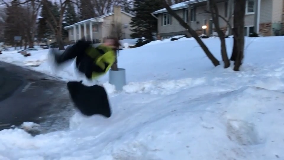 Kid Gets Off Sled With Brilliant Flip After Sliding Down on Snowy Path
