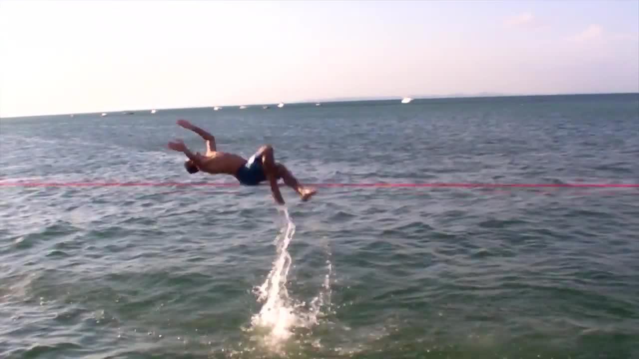 Guy Does Slack Line Flips Over Water Jukin Licensing