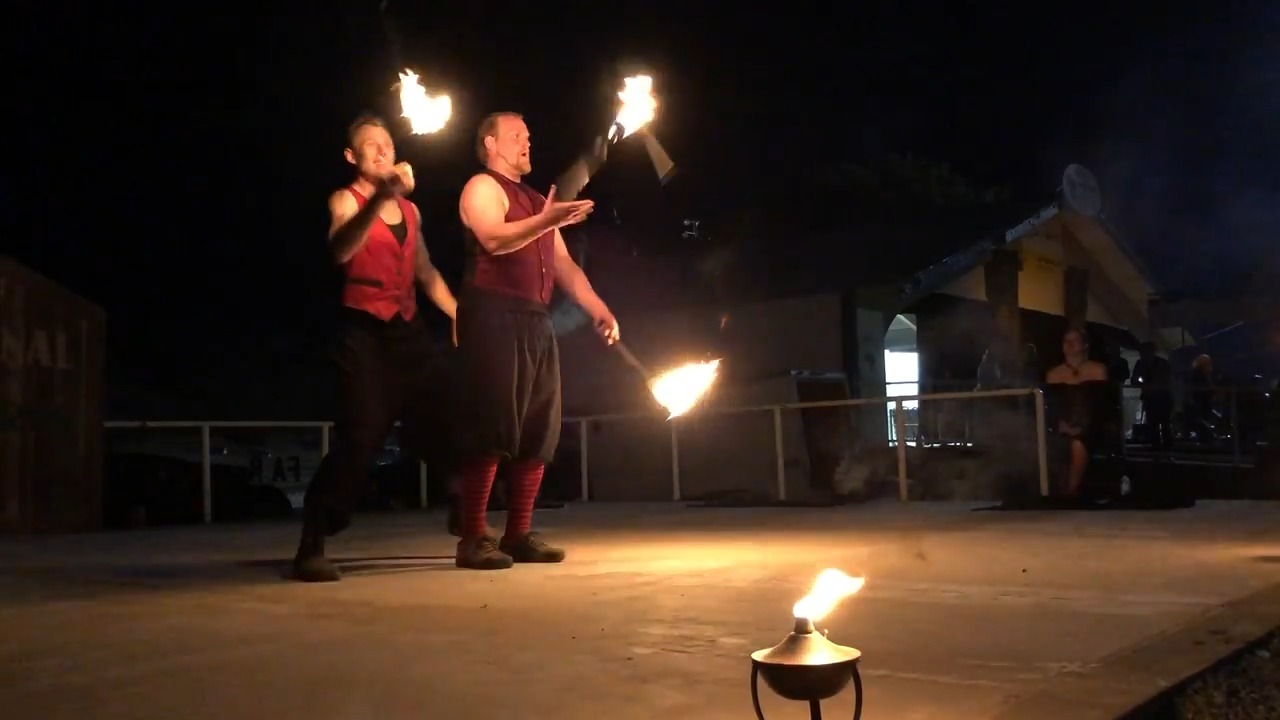 Brothers Juggle Lighted Sticks During Fire Performance At Show Jukin