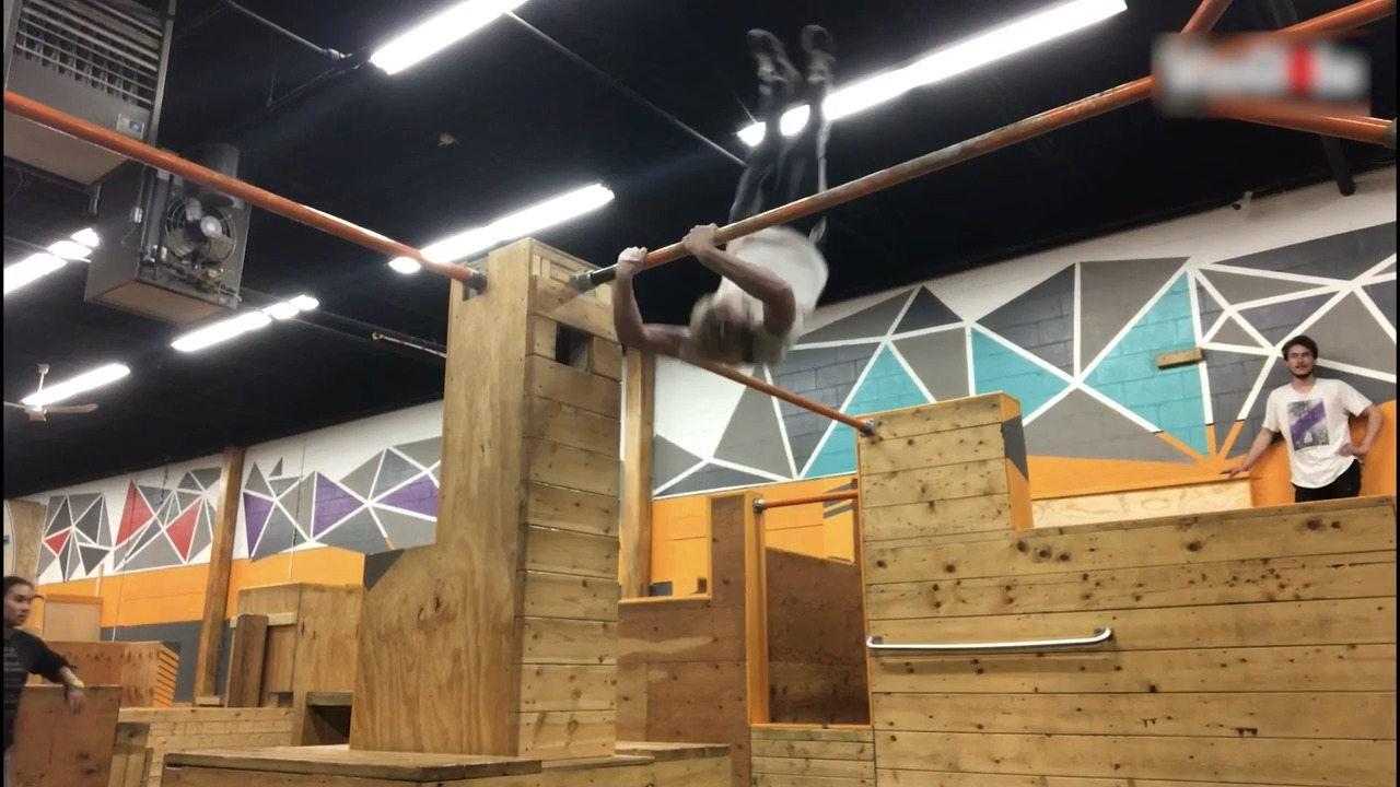 Guy Hits His Back on Wall While Swinging on Bar At Parkour Gym Jukin