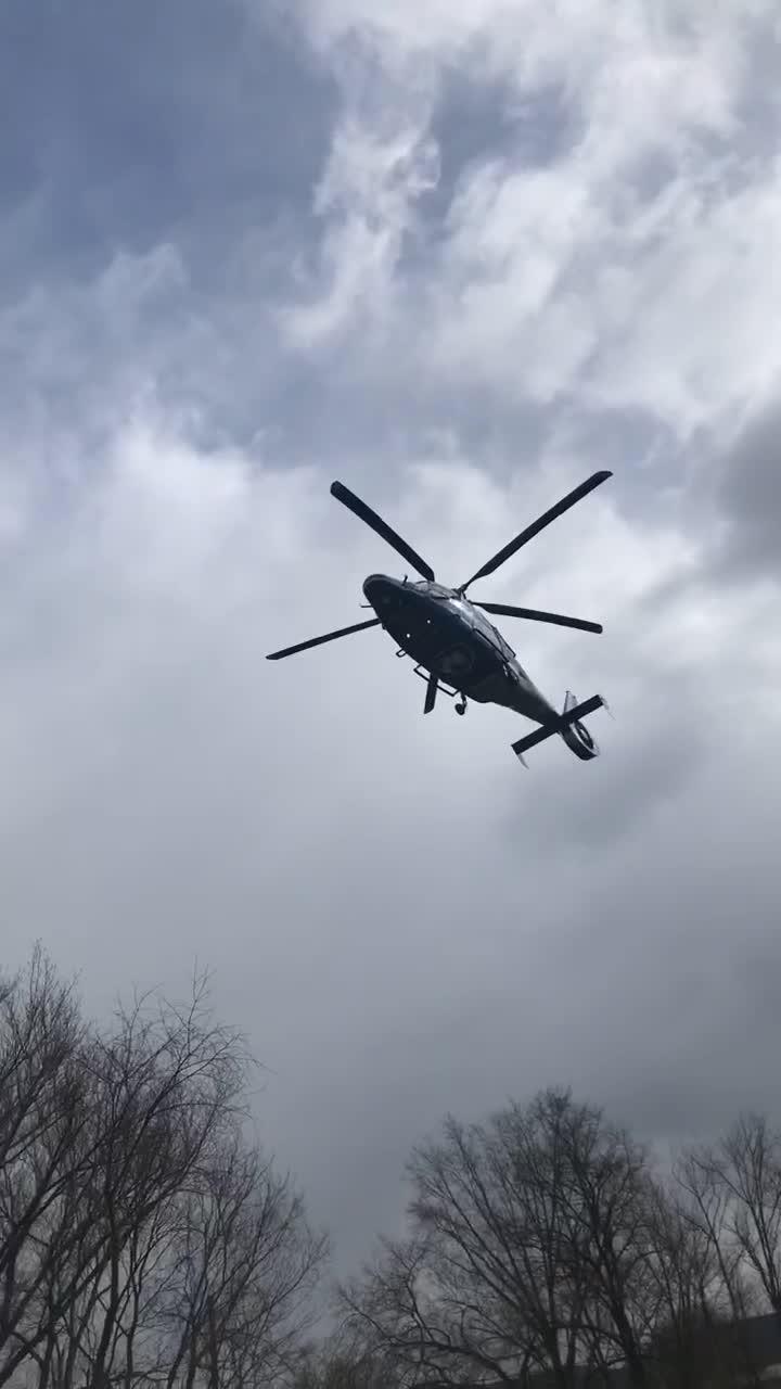 Helicopter Lands Giving Illusion that its Blades are not Spinning