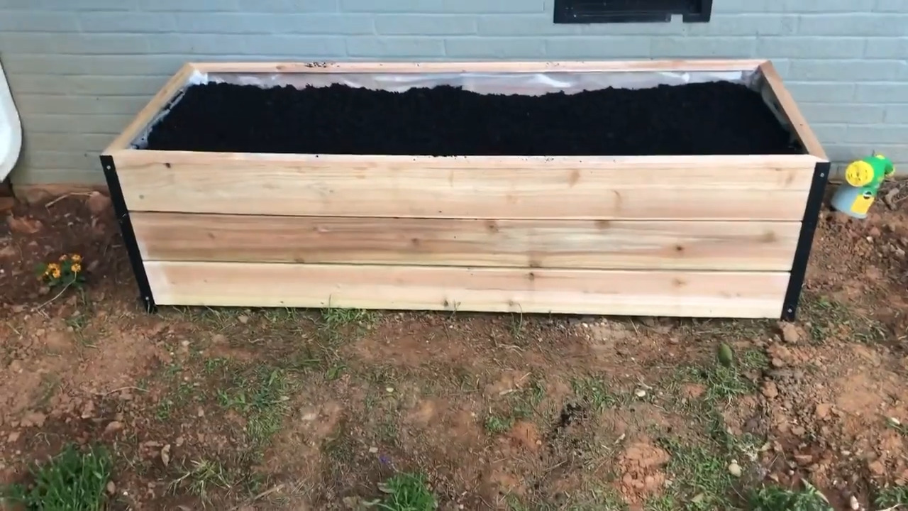 Person Builds DIY Raised Garden Bed Using Cedar Pickets Jukin Licensing