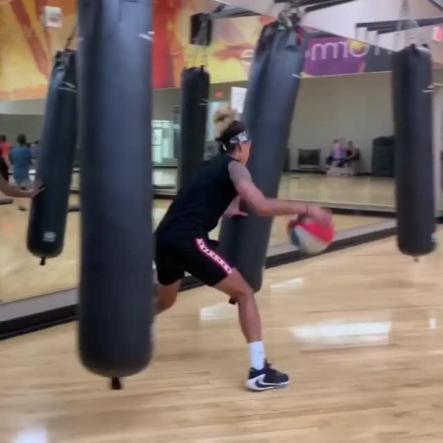 Girl Does Tough Basketball Dribbling Training While Dodging Swinging