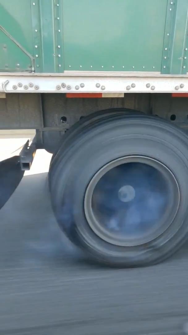 Driver Freaks Out After Truck Tire Explodes in Front of Car Jukin