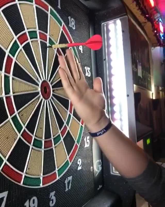 Guy Throws Dart and Nearly Hits Friend's Finger Jukin Licensing