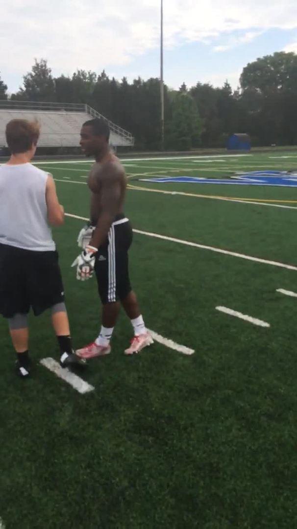 Football Player Jumps Over Defender during Practice Jukin Licensing