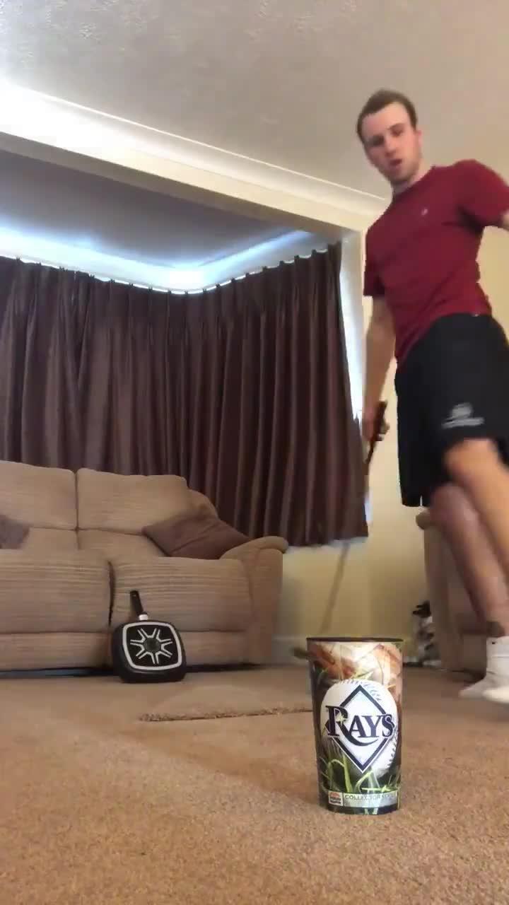 Guy Bounces Golf Ball Off Frying Pan Before Kicking It Into Plastic Cup