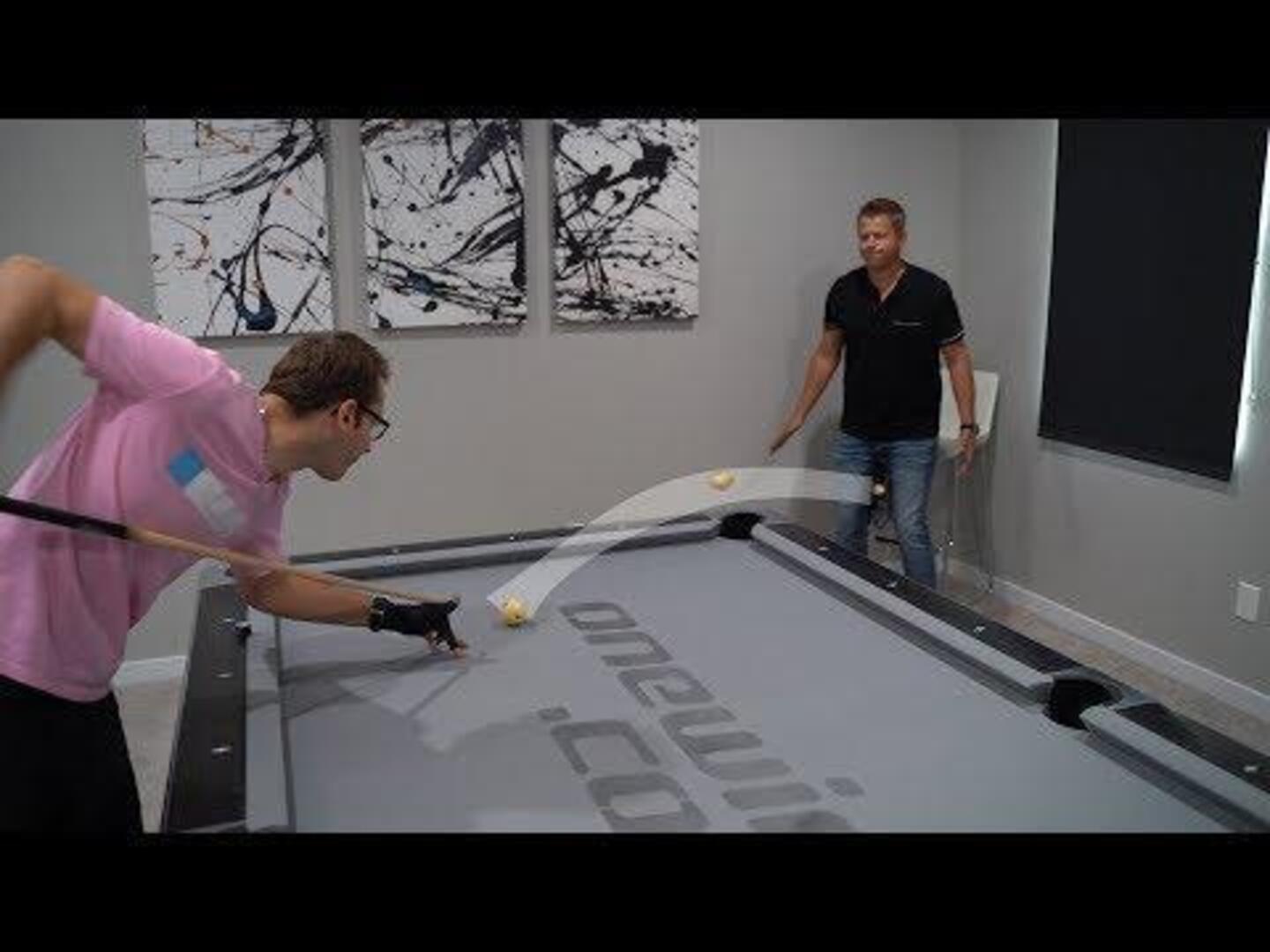 Professional CardThrower Competes Against Pool Trickshot Player