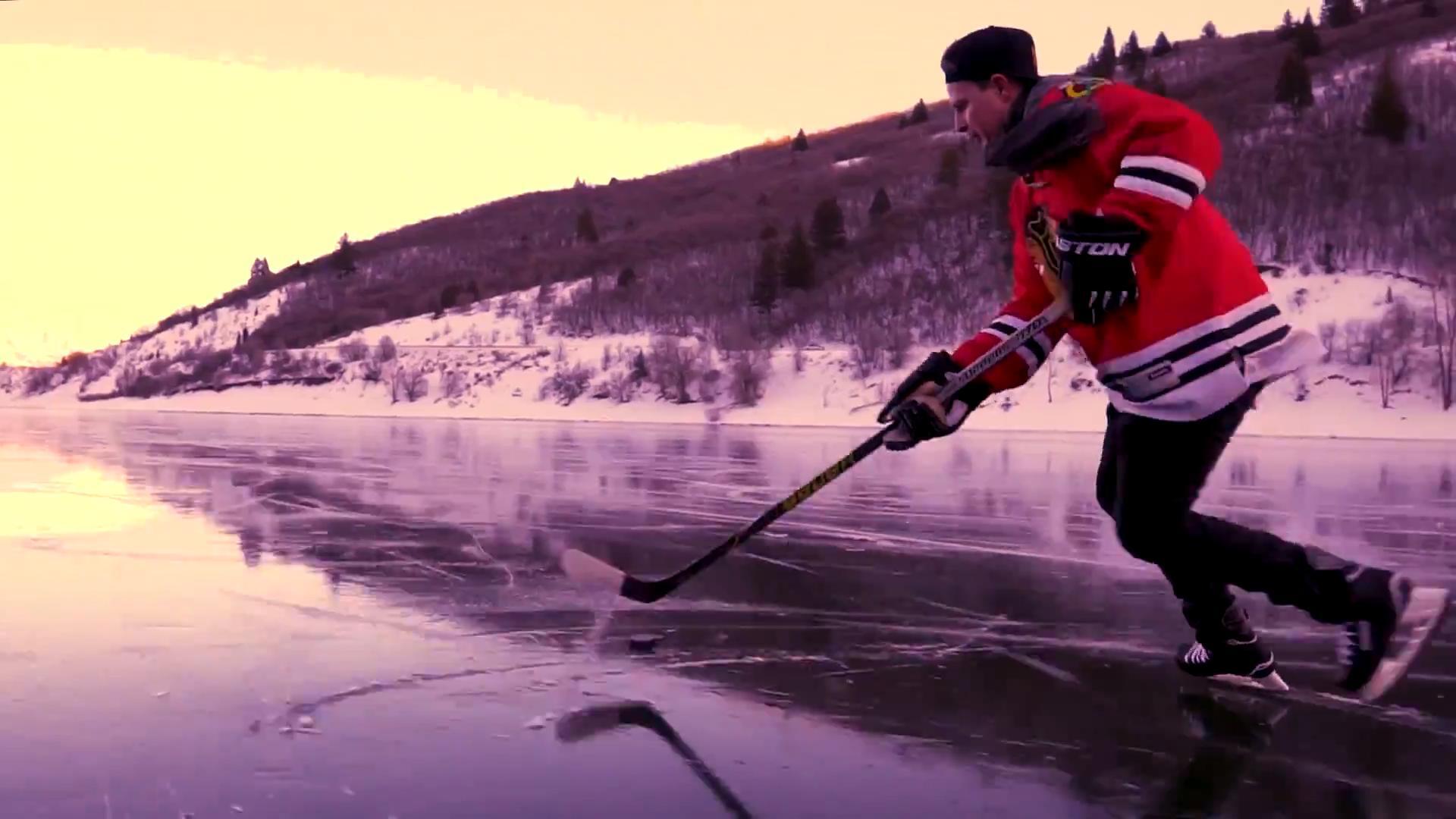 guys-play-ice-hockey-on-frozen-reservoir-jukin-licensing