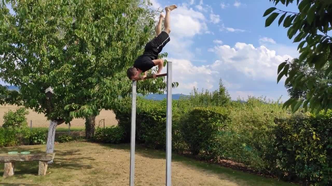 Guy Slips And Falls While Performing Handstand On Horizontal Bar