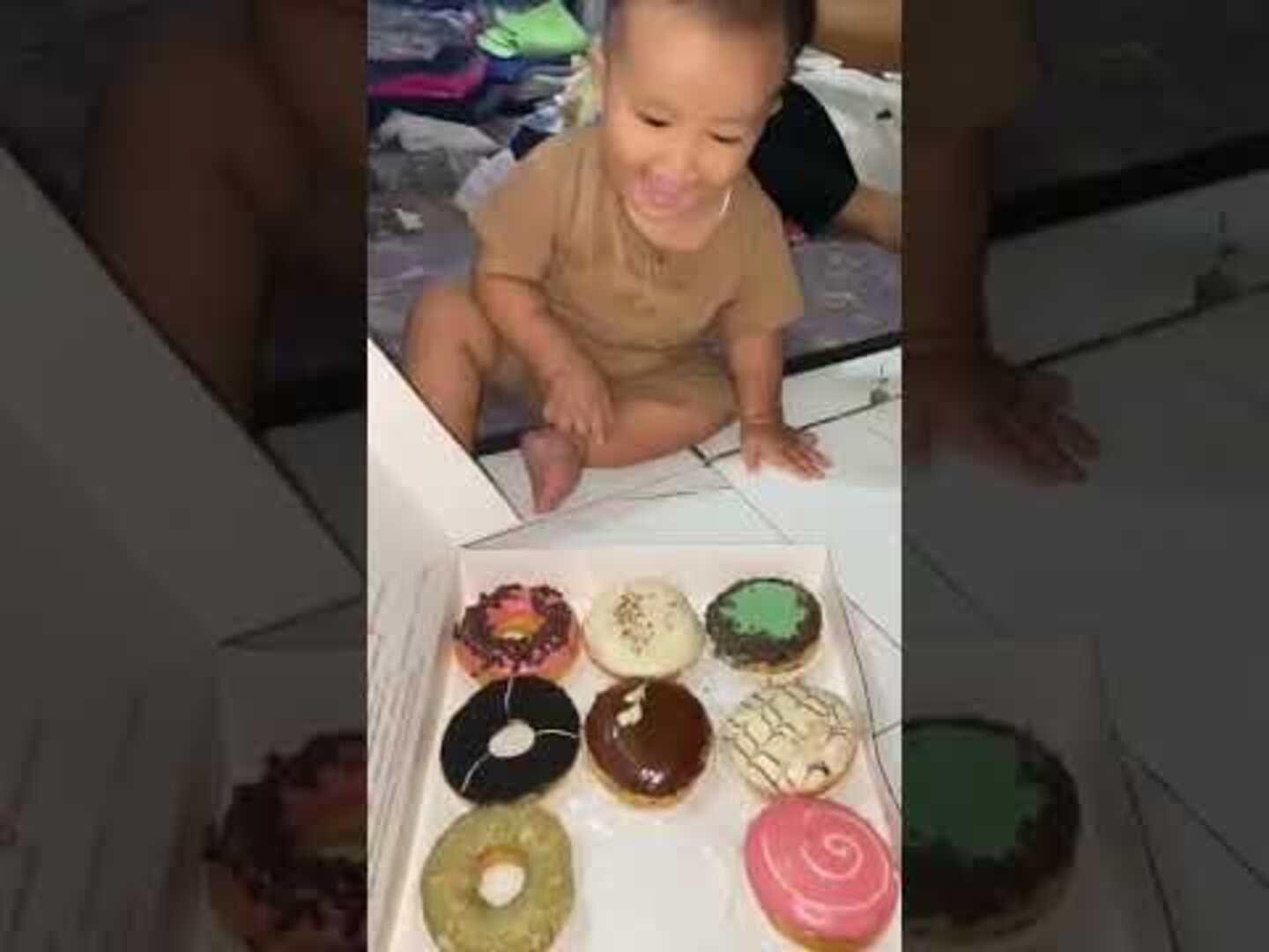 Excited Toddler Falls Head First Into Box of Donuts Jukin Licensing