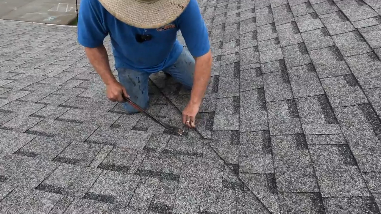 Man Shows How to Fix Leak in Valleys of Shingle Roof Jukin Licensing