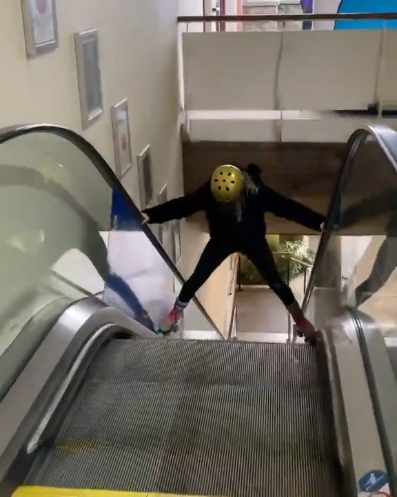 Woman Slides Down Escalator on Roller Skates Jukin Licensing