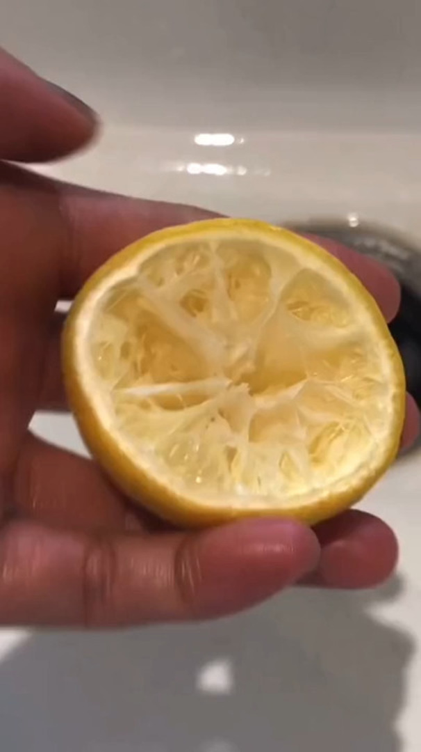 Person Shows Easy DIY Hack to Make Sink Smell Good Using Squeezed Lemons Jukin Licensing