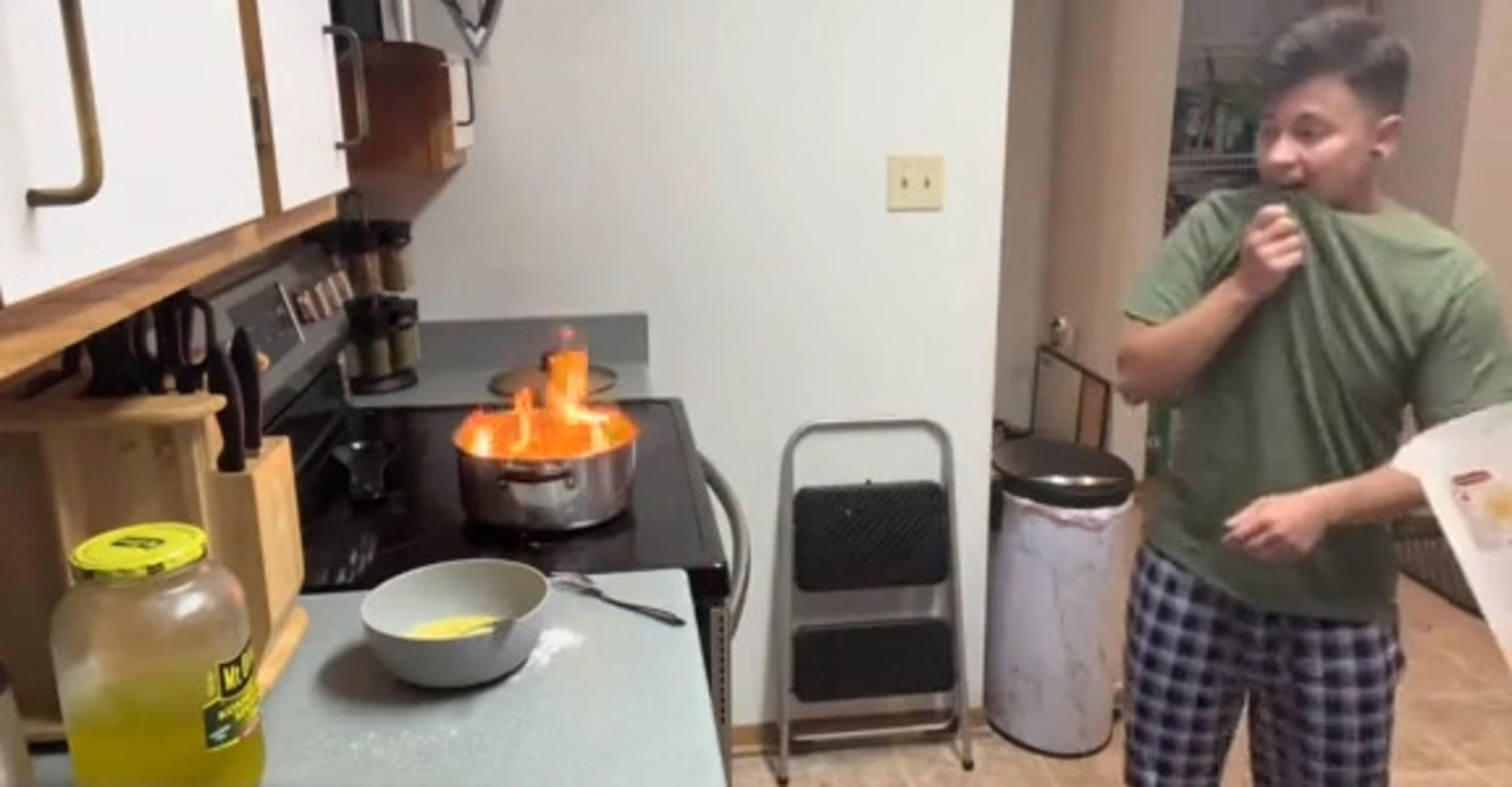 Guy Accidentally Sets Pot on Fire While Cooking Inside it Over Oven