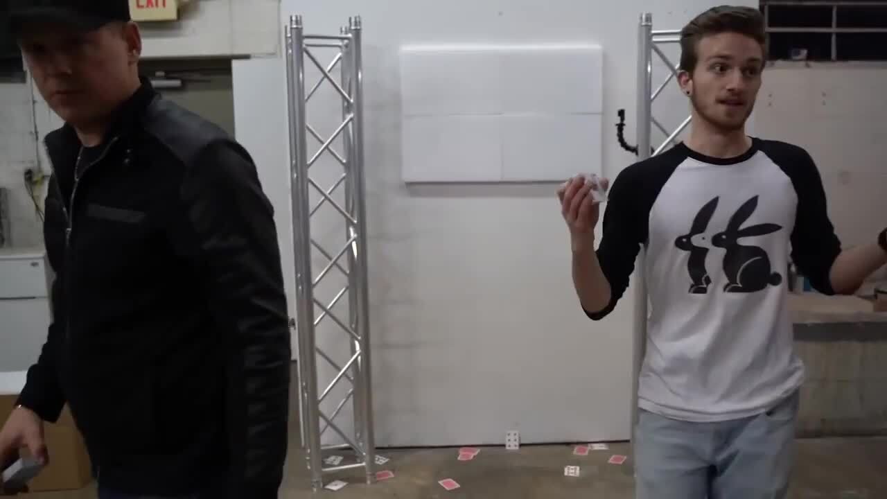 Magician Competes With Card Thrower at Card Throwing Trickshot