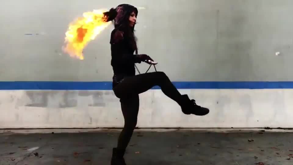 Woman Does Tricks with Flaming Rope Dart | Jukin Licensing