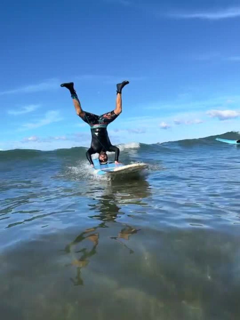 Man Holds Headstand While on a Surfboard Jukin Licensing